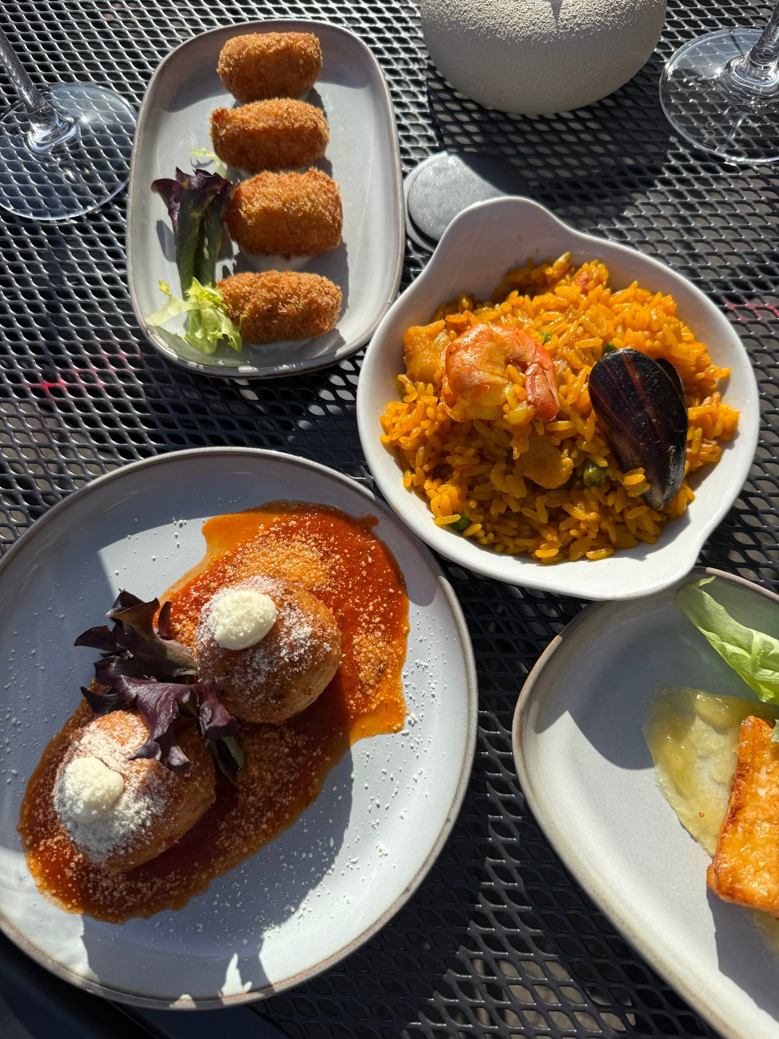 Small tapas plates arranged on a La Fonda table